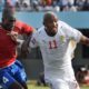 El-hadji-Diouf-battles-with-Mathew-Mendy-in-Gambia’s-1-1-draw-with-Senegal-in-Dakar